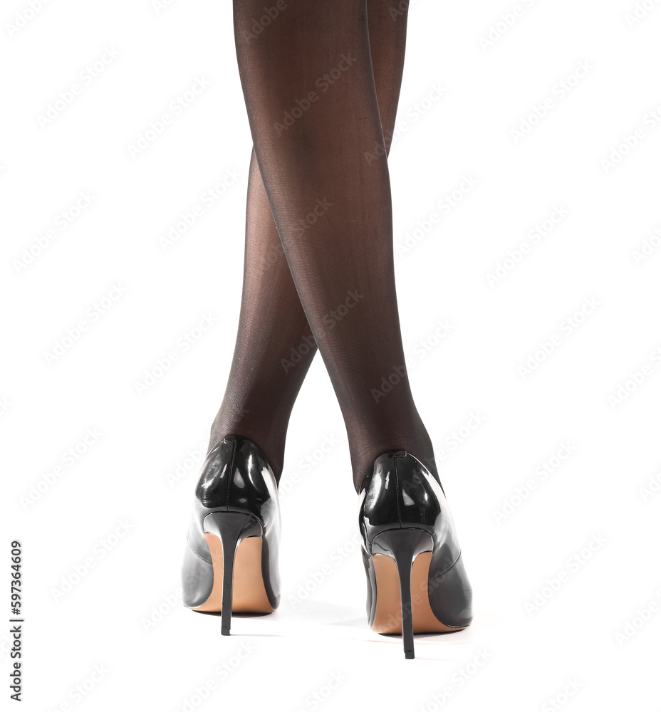 Legs of beautiful woman in black tights on white background, back view Legs of beautiful woman in black tights on white background, back view