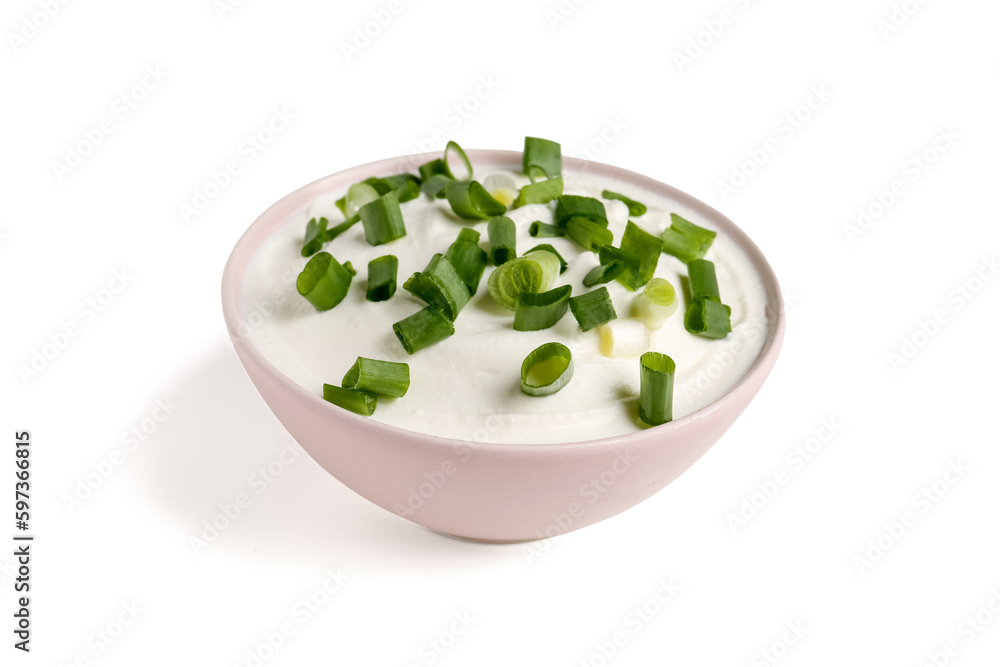 Bowl of tasty sour cream with green onion on white background Bowl of tasty sour cream with green onion on white background