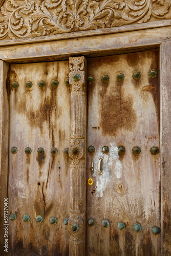 Traditional wooden carved door in Stone Town, Zanzibar, Tanzania