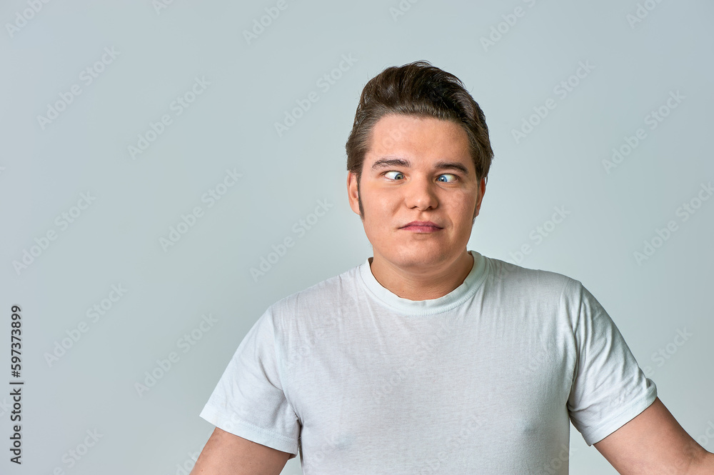 the man on the gray background brought his eyes together the man on the gray background brought his eyes together