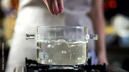 Water cooking cookware on stove . Cooking at home photo