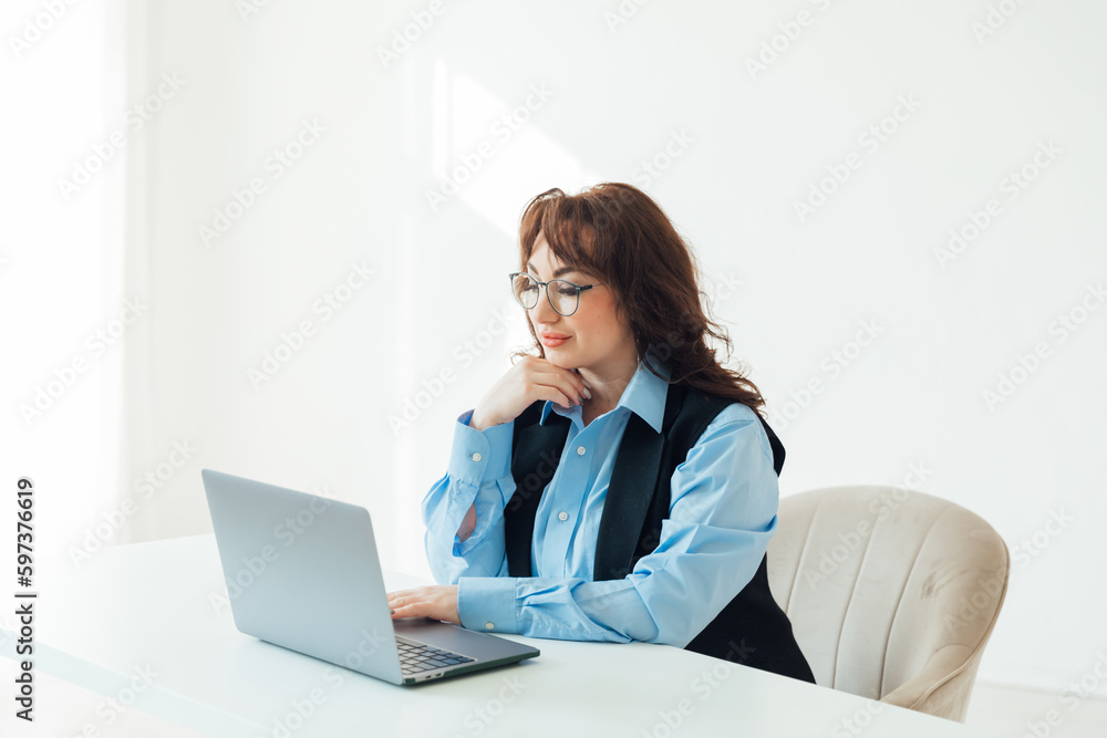 work at the computer a woman communicates online remotely work at the computer a woman communicates online remotely