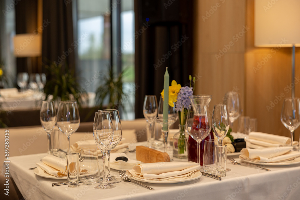 Served table set with empty wine glasses in french restaurant