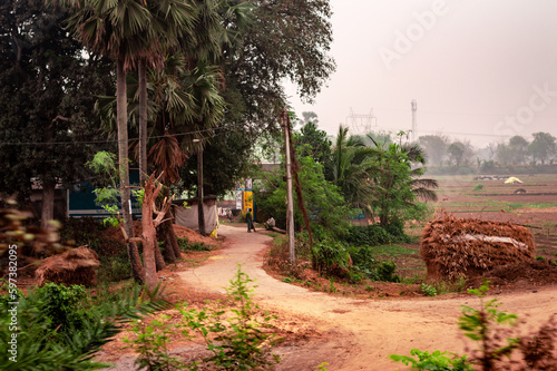 U Shaped dirt road of a rural village. Summer Landscape. Rural India. Bankura West Bengal India South Asia Pacific