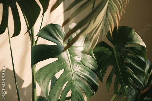 Shadows of lush green tropical leaves cast upon a soft pastel beige backdrop. Generative AI