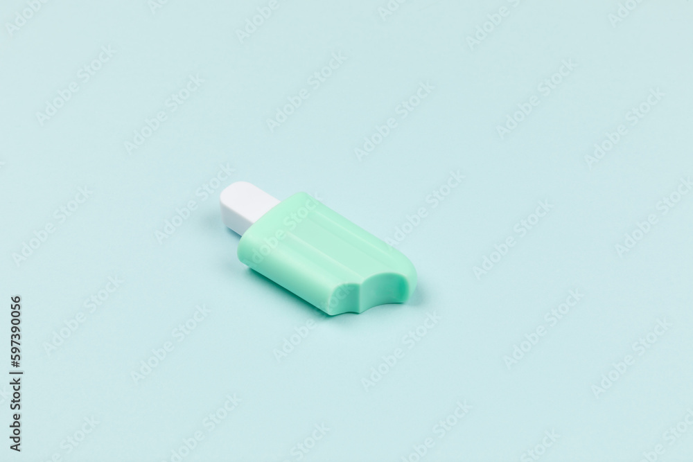 closeup of a popsicle on cyan surface icecream closeup of a popsicle on cyan surface icecream