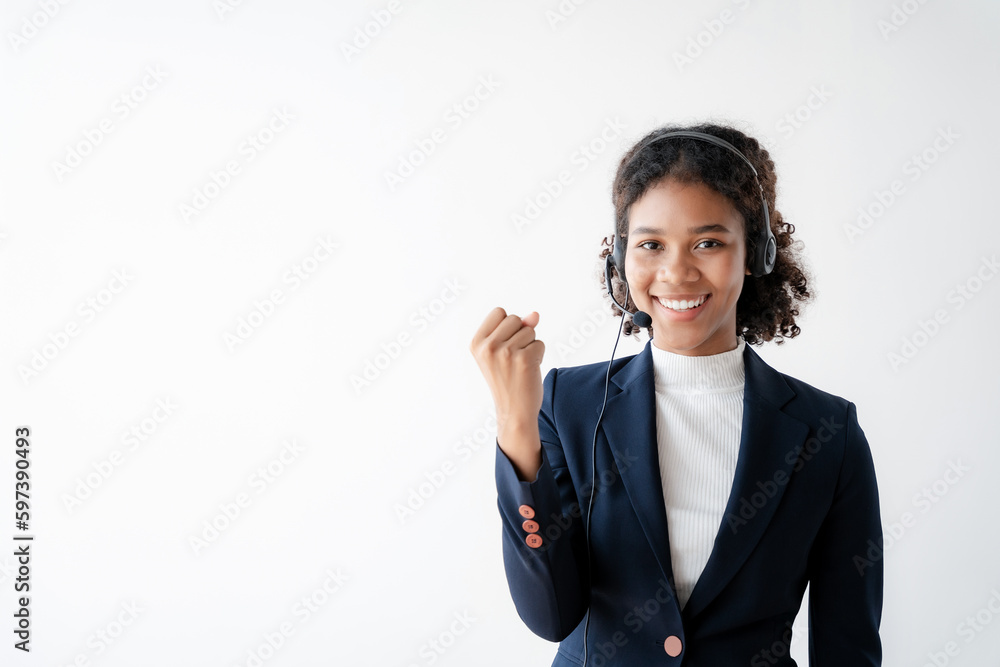 Friendly smiling female call-center agent with headset working on support hotline in office. Friendly smiling female call-center agent with headset working on support hotline in office.