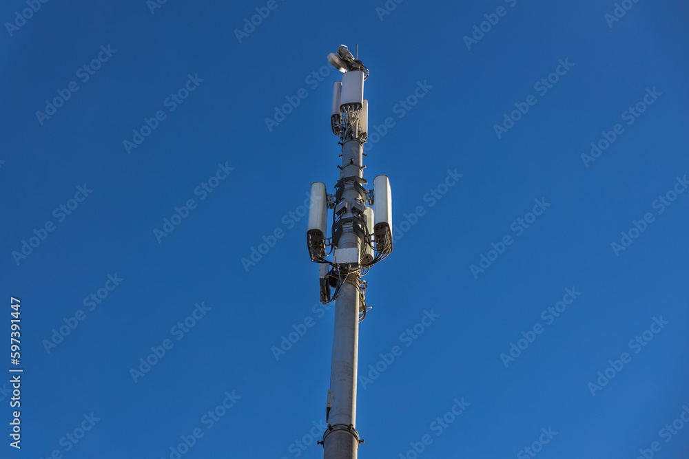 Close up of antenna repeater tower on blue sky