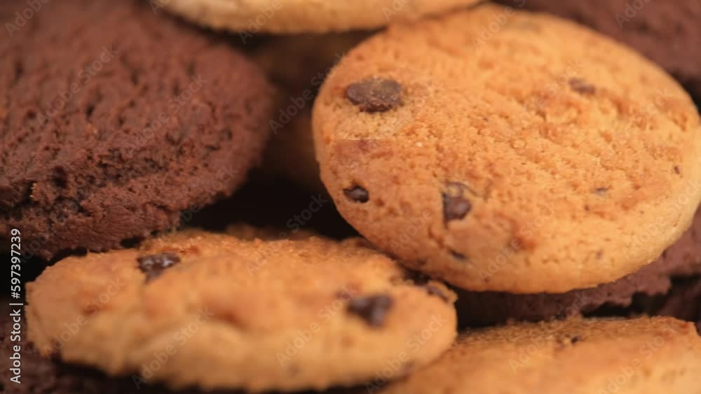 closeup rotation of different homemade cookies with chocolate chips, side view. concept of dessert, snacks, bakery, American cuisine, delicious junk food. selective focus. closeup rotation of different homemade cookies with chocolate chips, side view. concept of dessert, snacks, bakery, American cuisine, delicious junk food. selective focus.