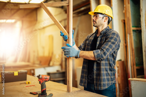Carpenter man attend to making masterpiece woodworks handcrafted furniture fine measure in wood workshop.