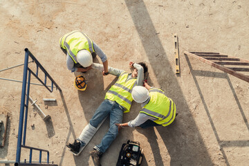 First aid worker accident in construction site, Builder accident fall scaffolding to concrete floor.