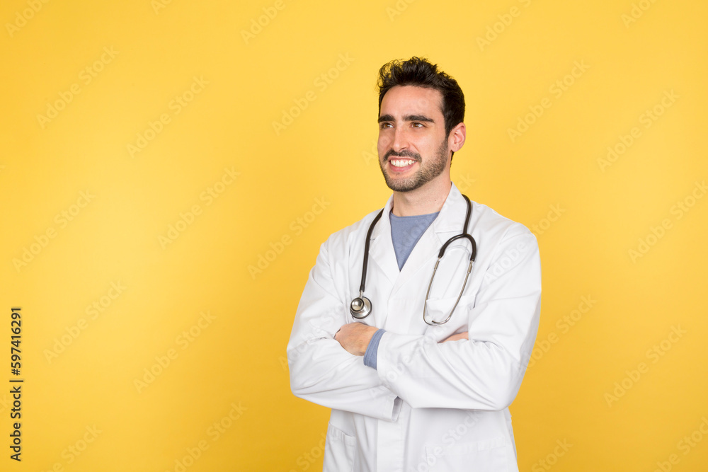 Smiling young doctor with arms crossed Smiling young doctor with arms crossed