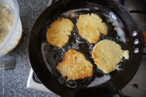 Polish potato pancakes with cheese on top. Savoury dinner recipe. Fried potato 