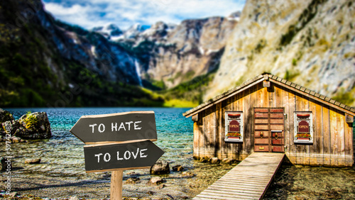 Street Sign TO LOVE versus TO HATE photo