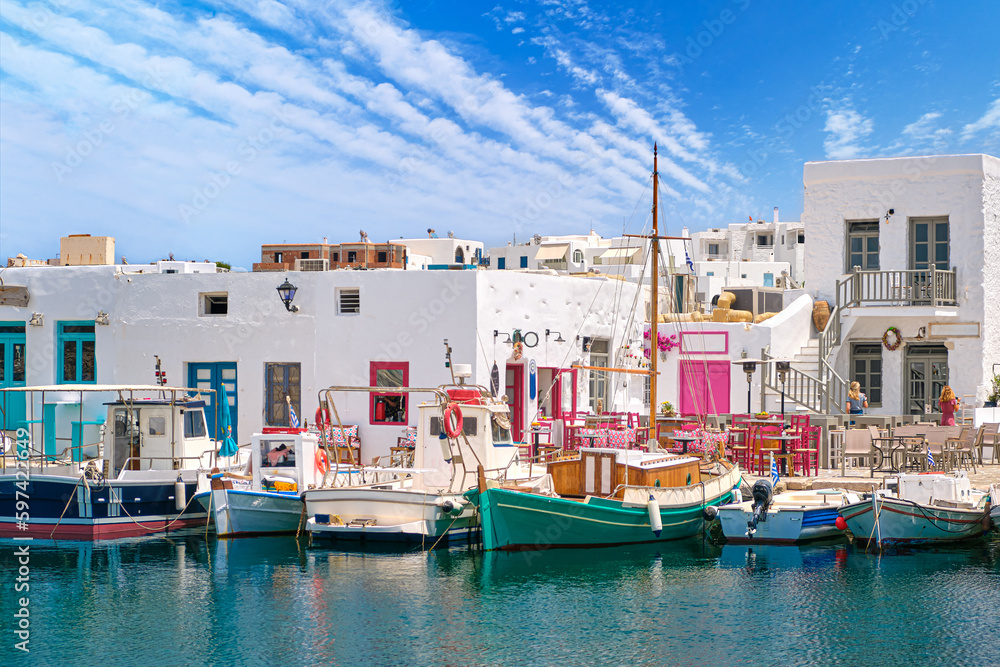 Outdoor dining by waterfront, fishing boat harbour of Naoussa, Paros