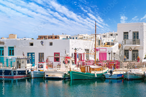 Outdoor dining by waterfront, fishing boat harbour of Naoussa, Paros