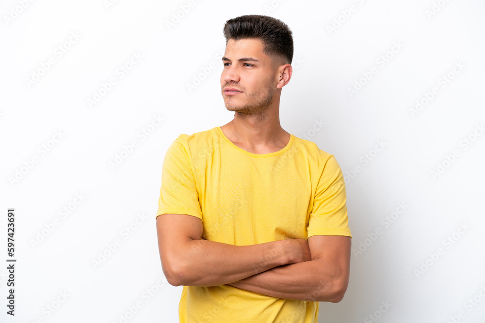 Young caucasian man isolated on white background looking to the side Young caucasian man isolated on white background looking to the side