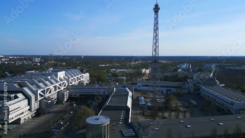 Funkturm with many stairs small eiffel tower. Majestic aerial top view flight 
Berlin City, Exhibition Grounds. speed ramp Hyperlapse motionlapse timelapse
4k uhd cinematic footage. photo