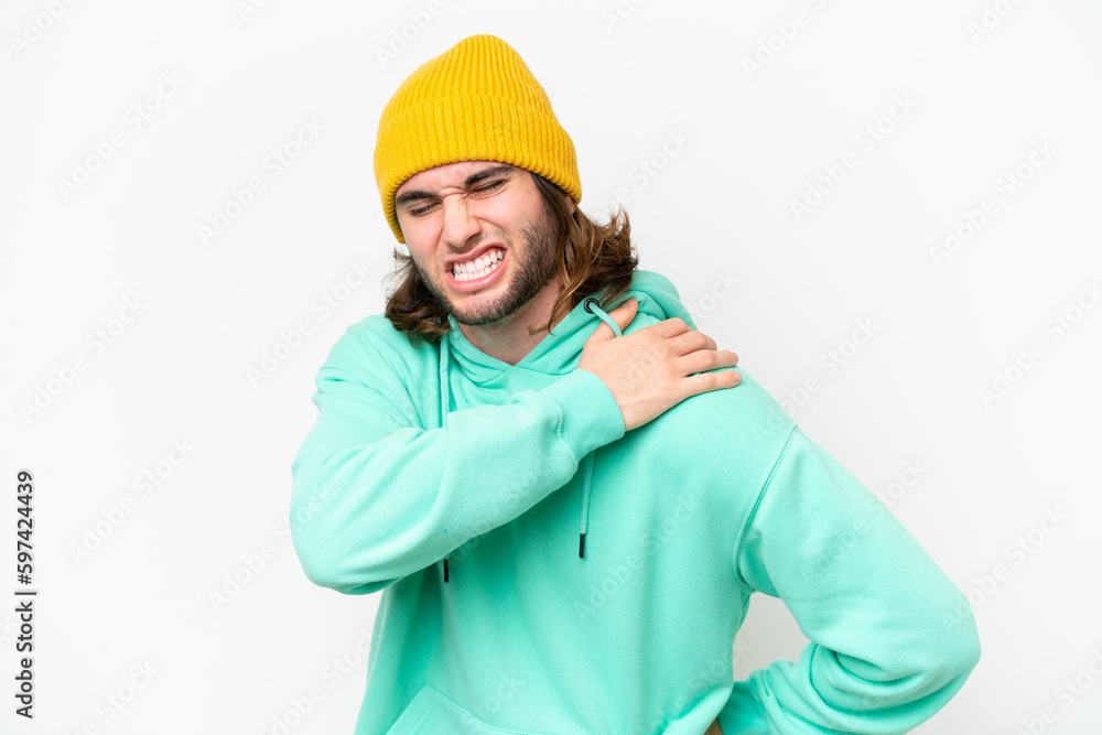 Young handsome man isolated on white chroma background suffering from pain in shoulder for having made an effort