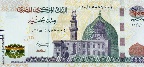 Large fragment of the obverse side of 200 LE two hundred Egyptian pounds banknote series 2022 features Qani-Bay mosque in Cairo Egypt, selective focus of Egypt cash money bill by central bank of Egypt photo