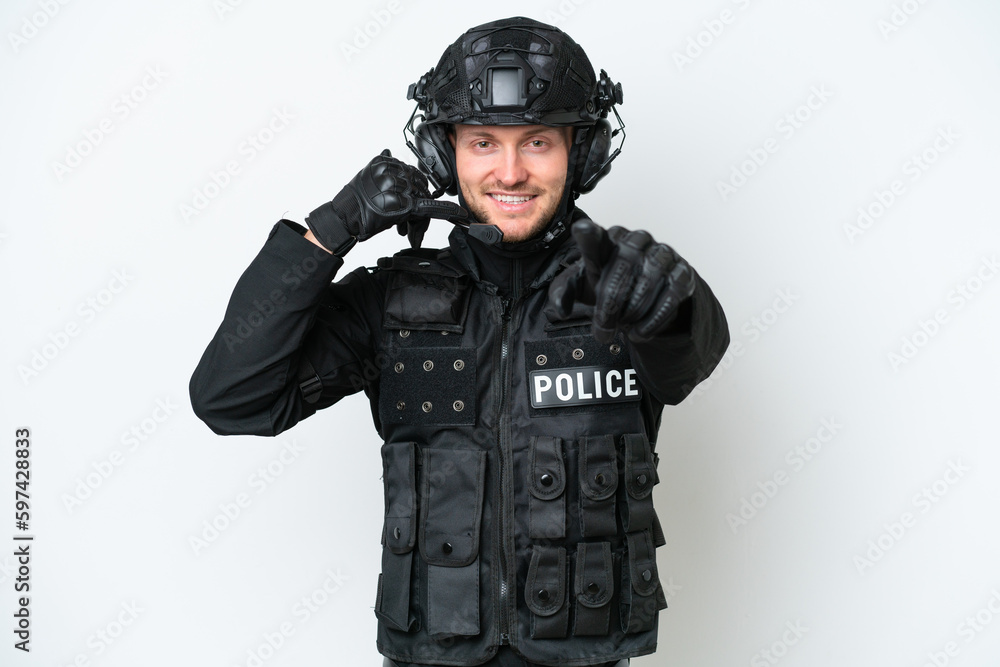SWAT man over isolated white background making phone gesture and pointing front SWAT man over isolated white background making phone gesture and pointing front