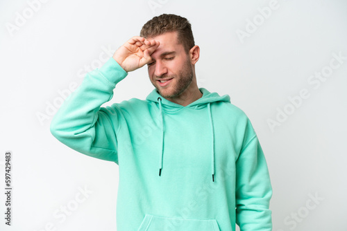 Young handsome caucasian man isolated on white background with tired and sick expression © luismolinero
