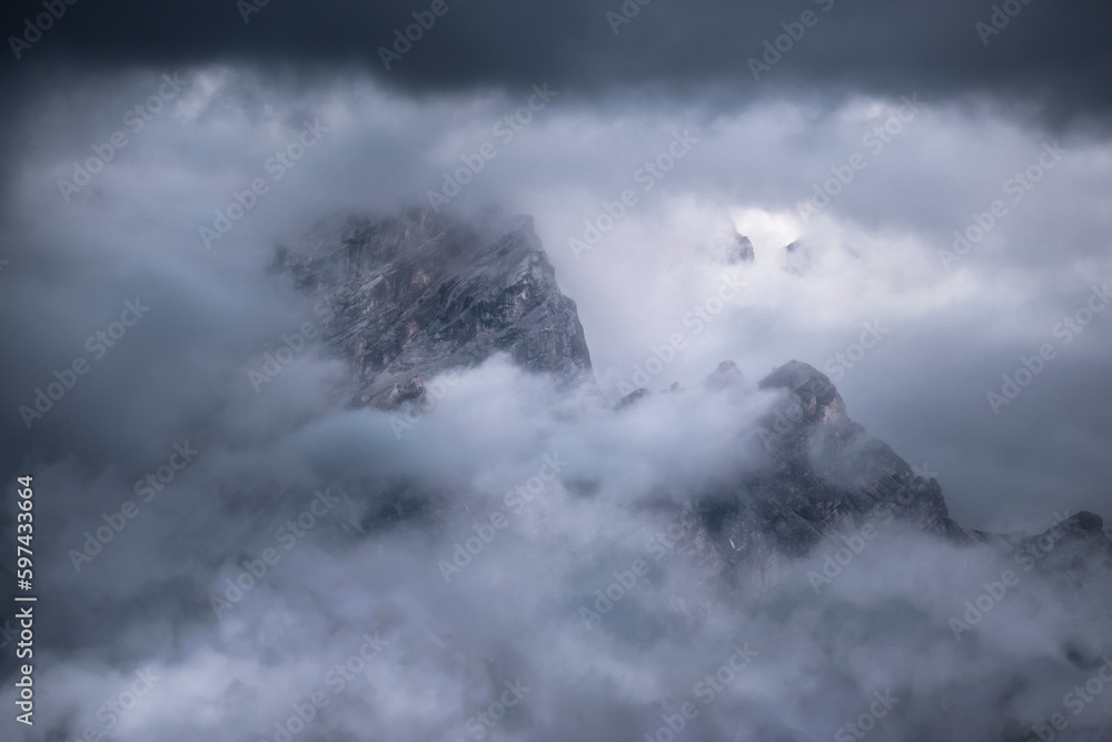 Dolomite rocks appearing in the mist and low clouds