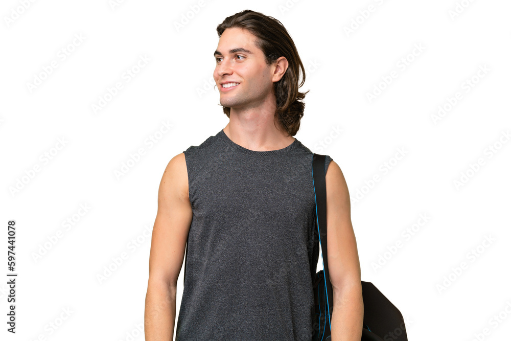 Young sport handsome man isolated on green chroma background looking side Young sport handsome man isolated on green chroma background looking side