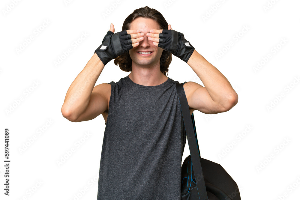 Young sport handsome man isolated on green chroma background covering eyes by hands Young sport handsome man isolated on green chroma background covering eyes by hands