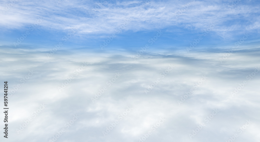  雲海を抜けた風景、さわやかな青空と太陽と富士山、レンズフレアと七色のゴースト　夏・夏休み・旅行・飛行の背景イメージ