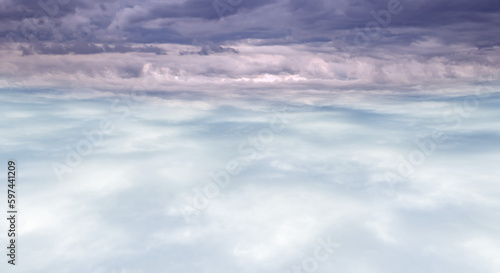  雲海を抜けた風景、さわやかな青空と太陽と富士山、レンズフレアと七色のゴースト 夏・夏休み・旅行・飛行の背景イメージ
