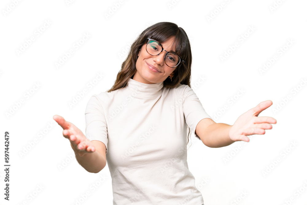 Young caucasian woman over isolated background presenting and inviting to come with hand Young caucasian woman over isolated background presenting and inviting to come with hand