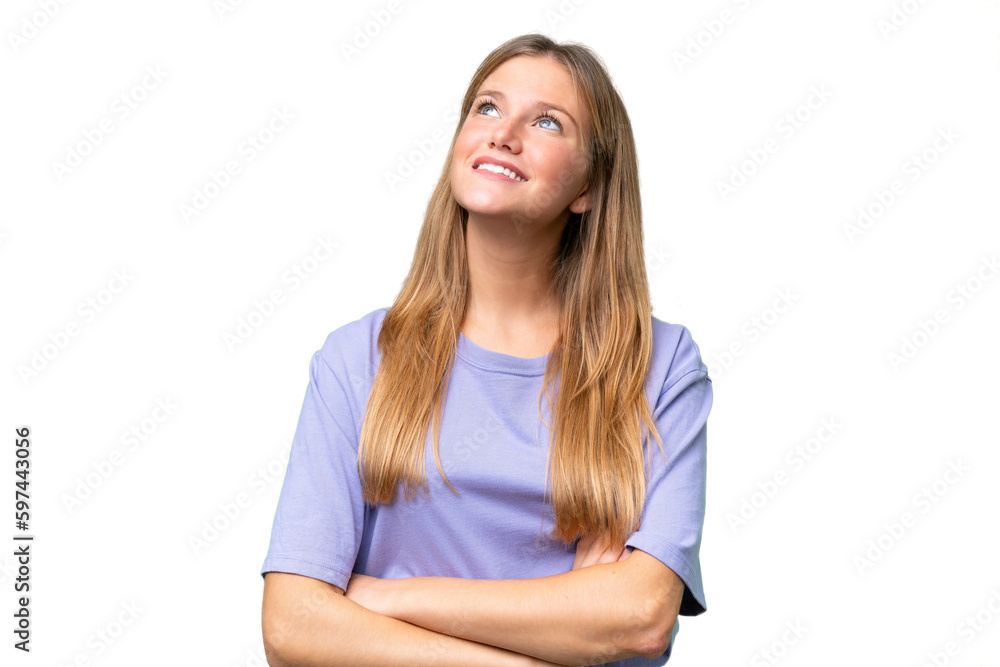 Young beautiful woman over isolated background looking up while smiling Young beautiful woman over isolated background looking up while smiling