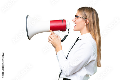 Young business caucasian woman over isolated background shouting through a megaphone