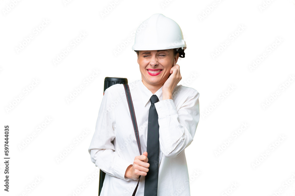 Young architect woman with helmet and holding blueprints over isolated background frustrated and covering ears