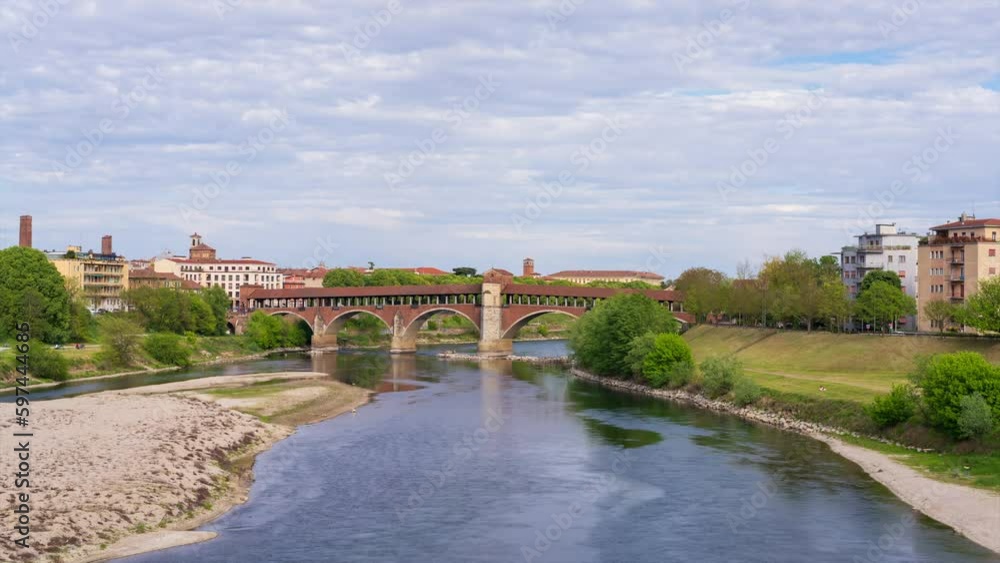 Ponte Coperto (covered bridge) in Pavia at cloudy day, Lombardy, italy. Timelapse 30 fps. Ponte Coperto (covered bridge) in Pavia at cloudy day, Lombardy, italy. Timelapse 30 fps.