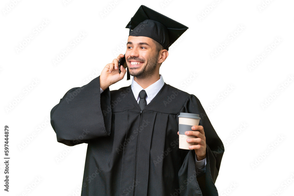 Young university graduate man over isolated background holding coffee to take away and a mobile Young university graduate man over isolated background holding coffee to take away and a mobile