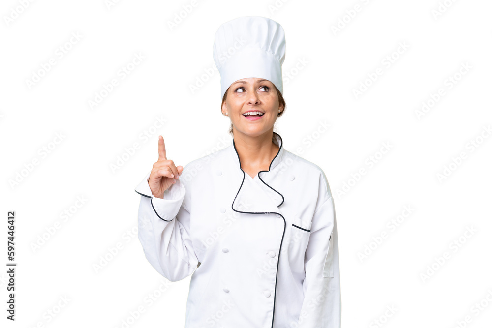 Middle-aged chef woman over isolated background pointing up and surprised Middle-aged chef woman over isolated background pointing up and surprised