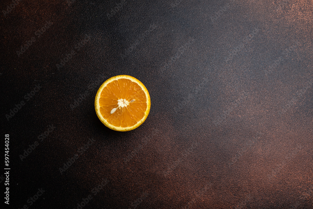 An orange on a brown background