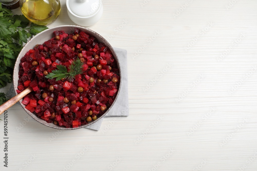 Delicious fresh vinaigrette salad on white wooden table, flat lay. Space for text Delicious fresh vinaigrette salad on white wooden table, flat lay. Space for text