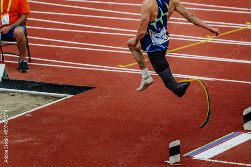 Quadro su tela male para athlete on limb deficiency long jump take off board, summer para athle