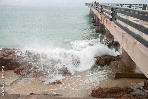 Wide angle: waves crash onto rocks below Shark Rock Pier in Port Elizabeth photo