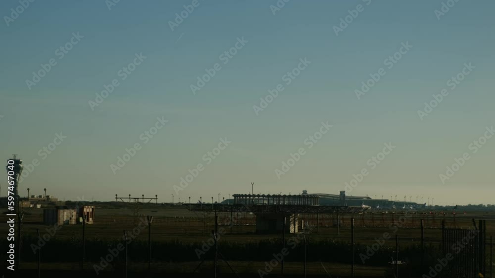 Silhouette of a passenger plane that lands at the airport at sunset in winter concept travel vacation adventure Silhouette of a passenger plane that lands at the airport at sunset in winter concept travel vacation adventure