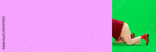 Male body in classical clothes over pink and green background. Pop art photography. Space for text. Concept of art, creative vision, fashion. Complementary colors. Banner. Copy space for ad