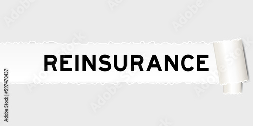 Ripped gray paper background that have word reinsurance under torn part