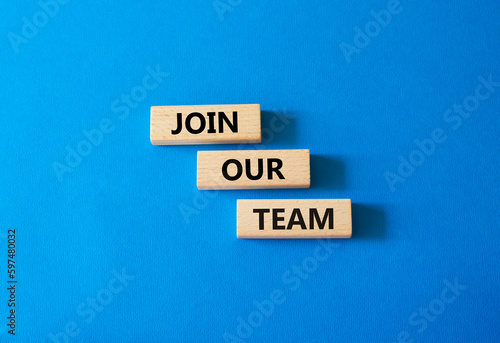 Join our team symbol. Wooden blocks with words Join our team. Beautiful blue background. Business and Join our team concept. Copy space.