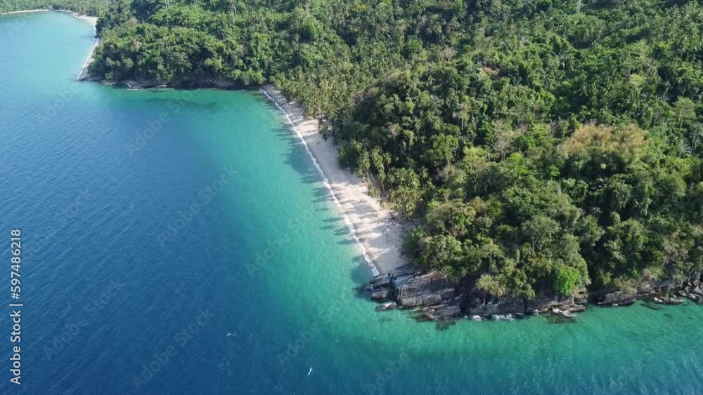 Tropical landscape. Aerial view of a sandy beach and tropical rainforest on a tropical island. Sea, beach, jungle. Tropical landscape. Aerial view of a sandy beach and tropical rainforest on a tropical island. Sea, beach, jungle.