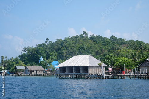 Traditional floating house in Sawinggrai Village, Raja Ampat, Indonesia