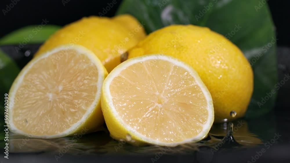juicy ripe fruit is poured with water on dark background, the byzgi scatter in different directions slow motion, close-up juicy ripe fruit is poured with water on dark background, the byzgi scatter in different directions slow motion, close-up