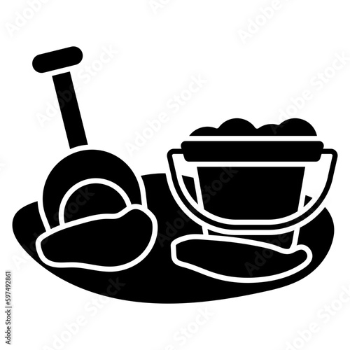 Shovel with mud and basket denoting concept of mud pail 